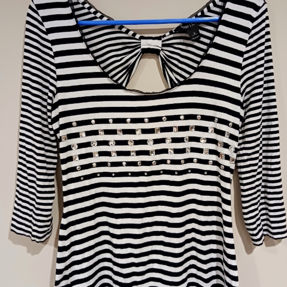 Never worn black and white top. Stone detail on the front.